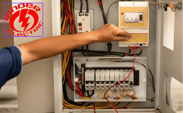 A person is working on an electrical panel.