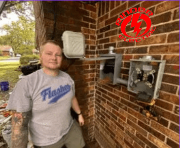 A man standing in front of an electrical box.